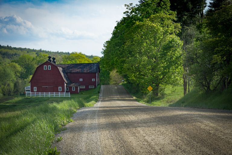 Red barn on dirt road Red barn on dirt road